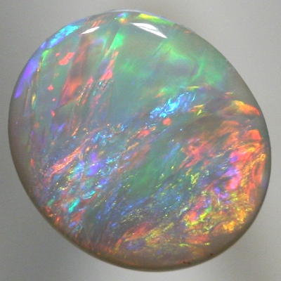 SOLID SEMI BLACK OPAL Pretty opal. Red and orange over green and purple. With VIDEO